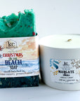 Green soap bar with 'Christmas on the Beach' packaging and a white candle labeled 'Margate' on a white background. Beach christmas soap and candle set, margate new jersey shore, beach soap and candle, sea soap