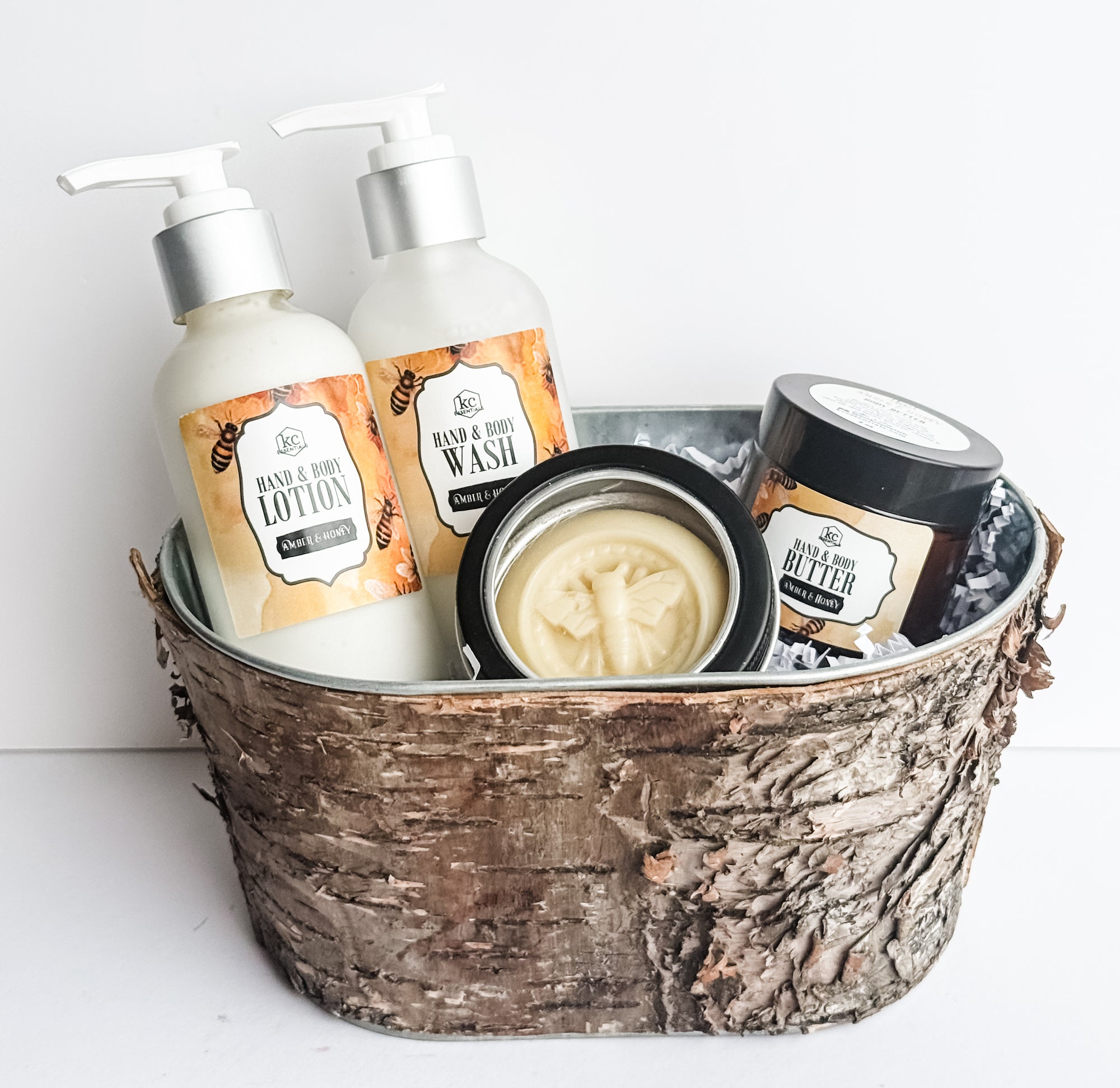 Amber and honey gift set includes hand and body lotion, hand and body wash, body butter, and lotion bar. All amber and honey scented. All natural gift set.