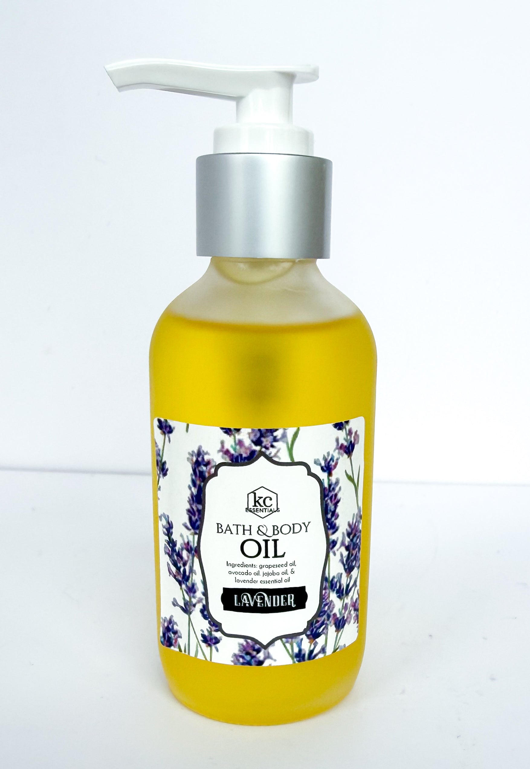 Bottle of bath and body oil with lavender design on a white background, made with all natural oils and essential oils for scent