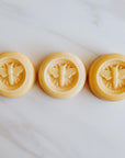 Bee lotion bar, available in three scents: lemon, lavender, honey.