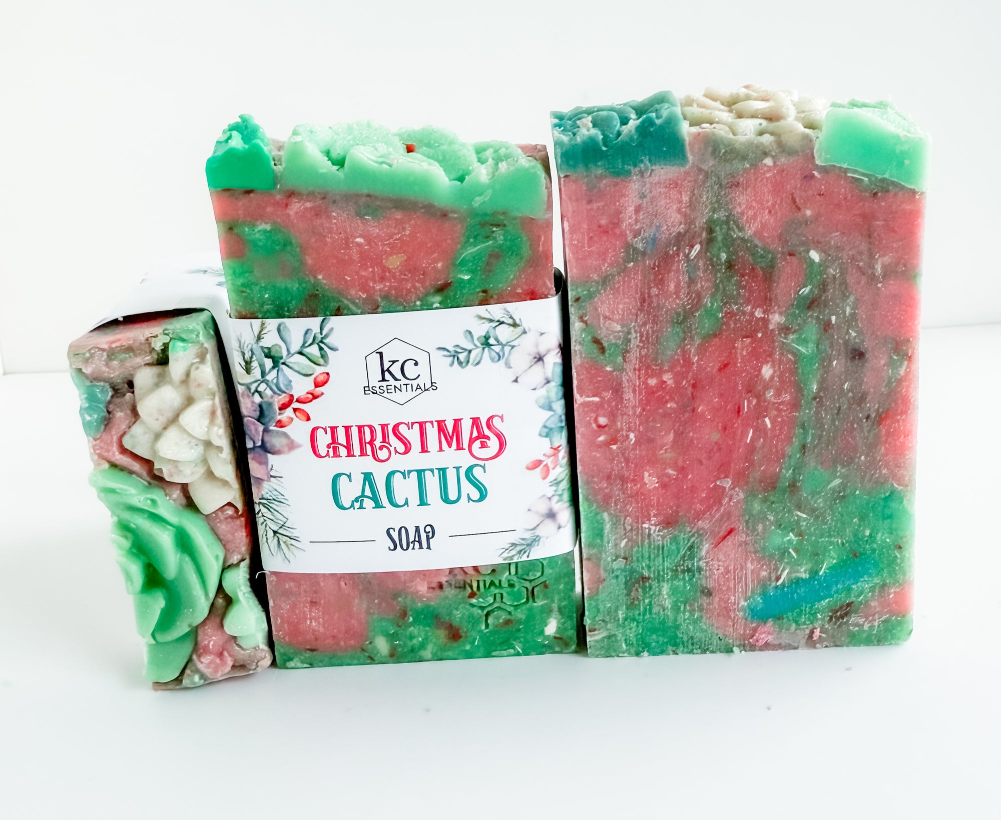 Christmas Cactus soap with a label on a white background, pink and green soap, holiday scented soap, christmas scented, festive, all natural ingredients, handmade, handcrafted soap bar