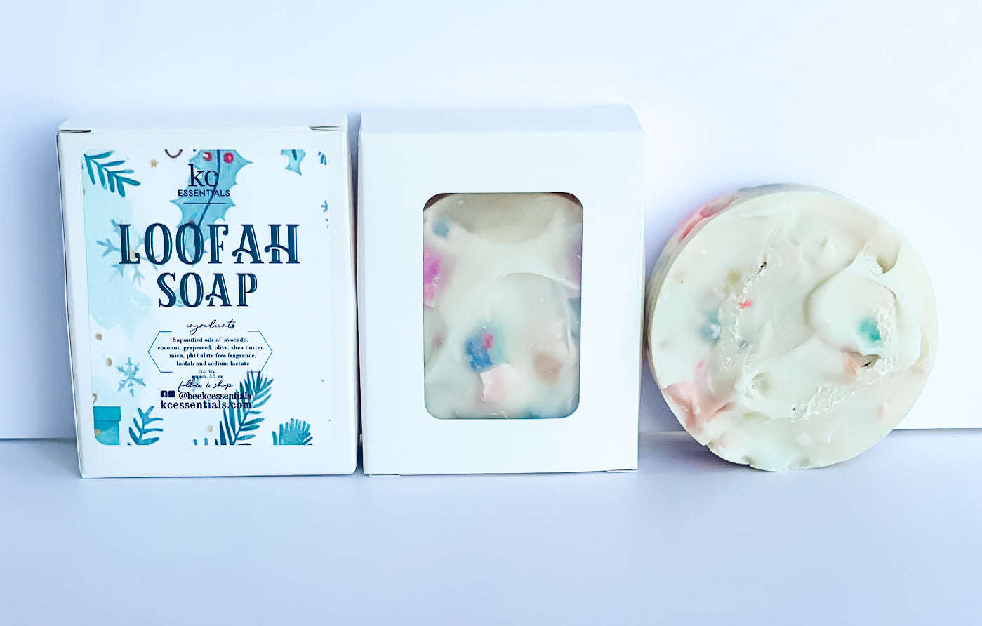 handcrafted loofah soap bar, packaged in a cardboard box, white color, unscented.