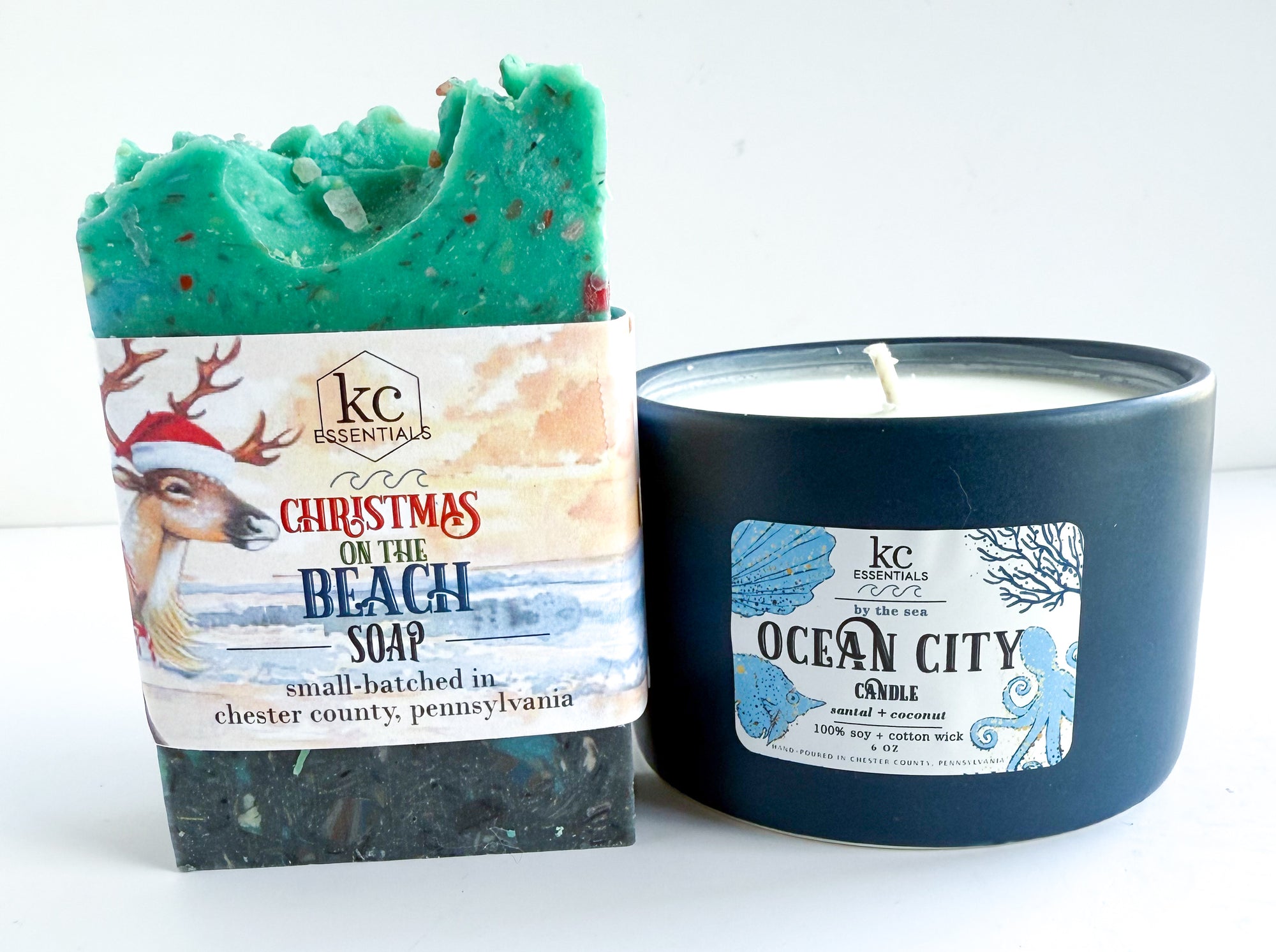 Christmas-themed soap and candle with labels on a white background. Christmas gift ideas, ocean city candle, ocean city new jersey, ocean city maryland beaches, delaware beaches, jersey shore, gift ideas, holiday gift ideas, christmas gift, beach scented