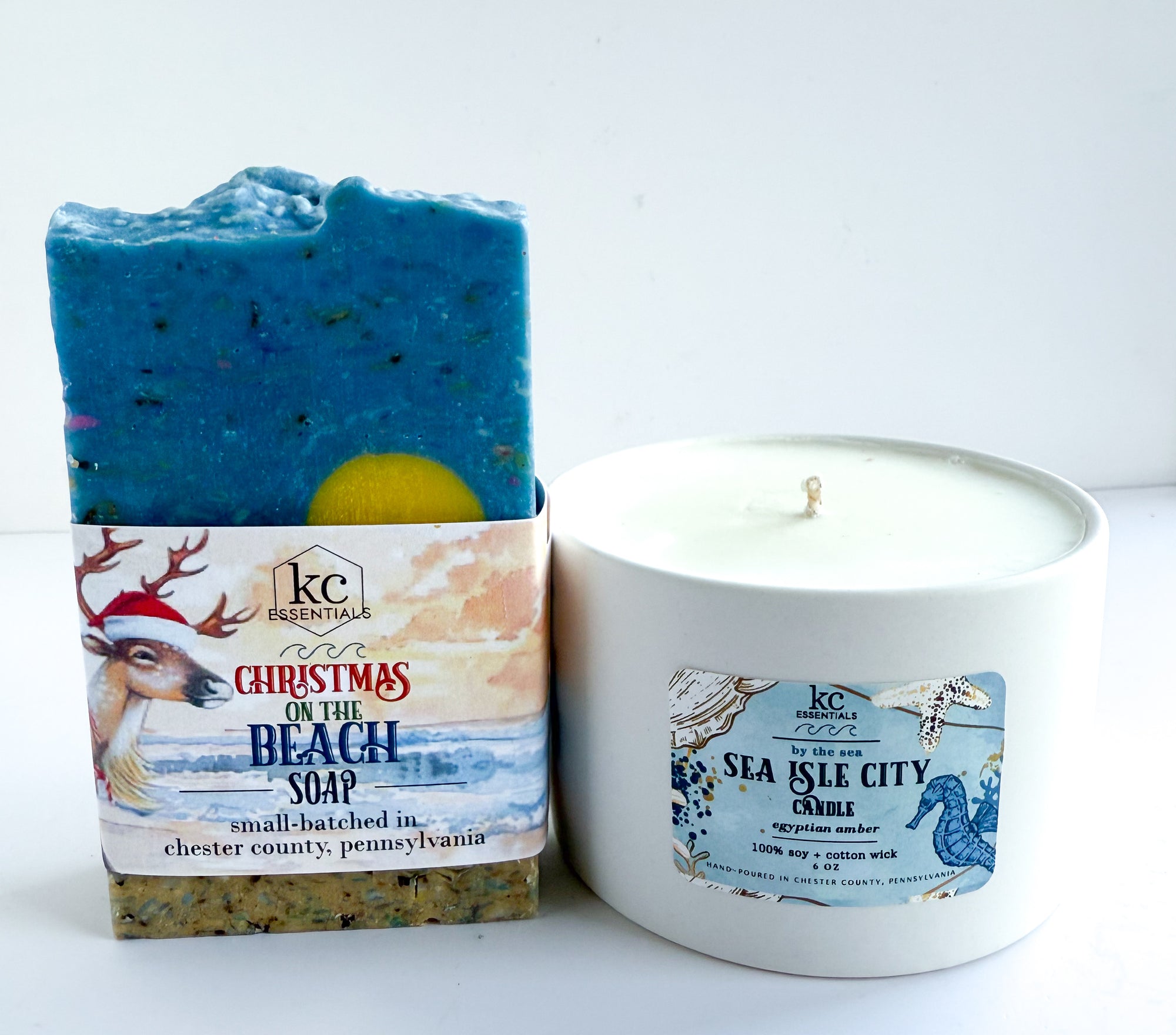 Bar of soap and candle with labels on a white background. Christmas on the Beach soap, handcrafted all natural soap bar, sea isle city beach, new jersey, jersey shore, egyptian amber scented candle, beach scented soap