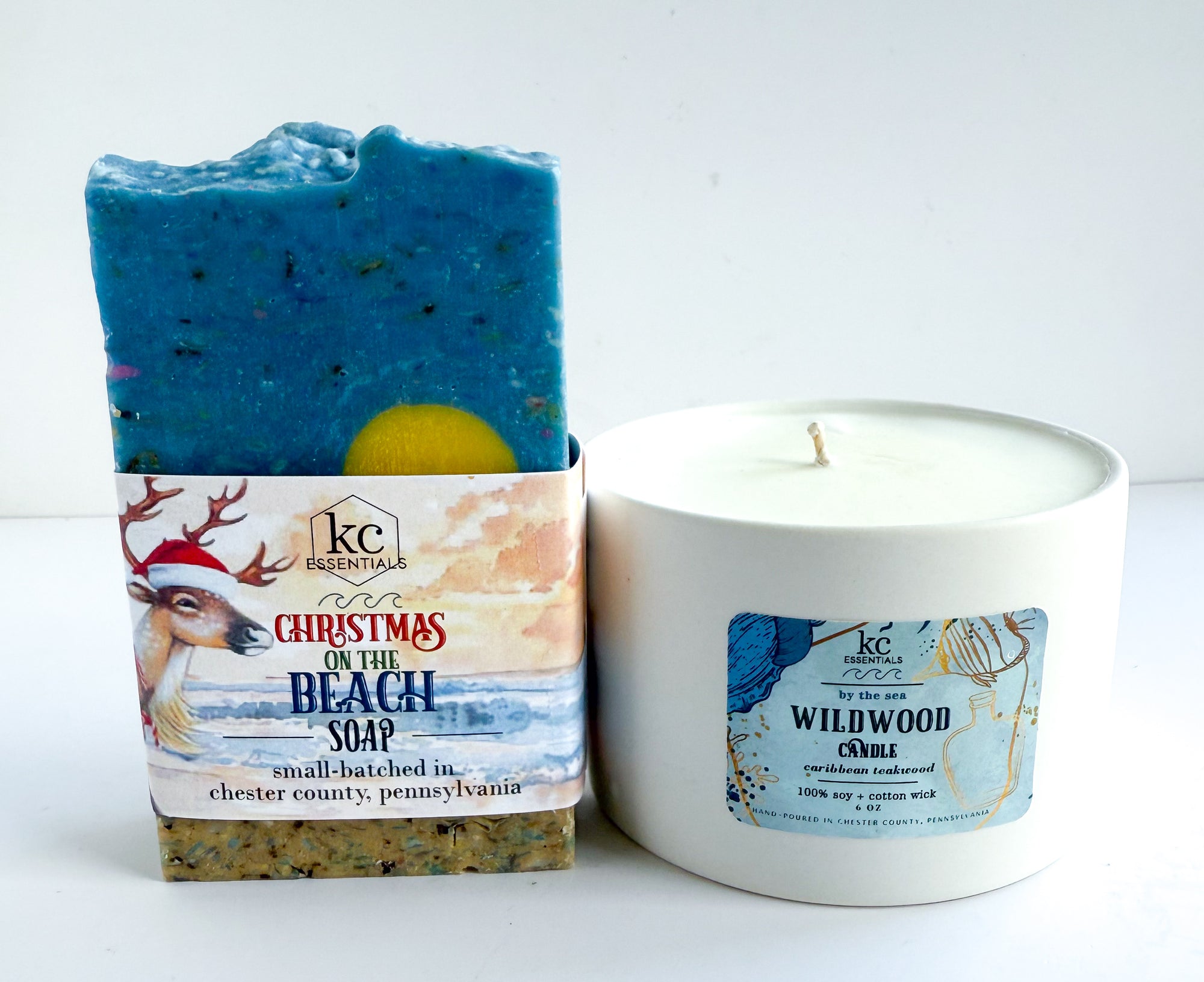 Bar of soap and candle with labels on a white background, white candle vessel, christmas on the beach soap, all natural hand soap, christmas gift ideas, festive, holiday gifts, wildwood beach, new jersey, jersey shore