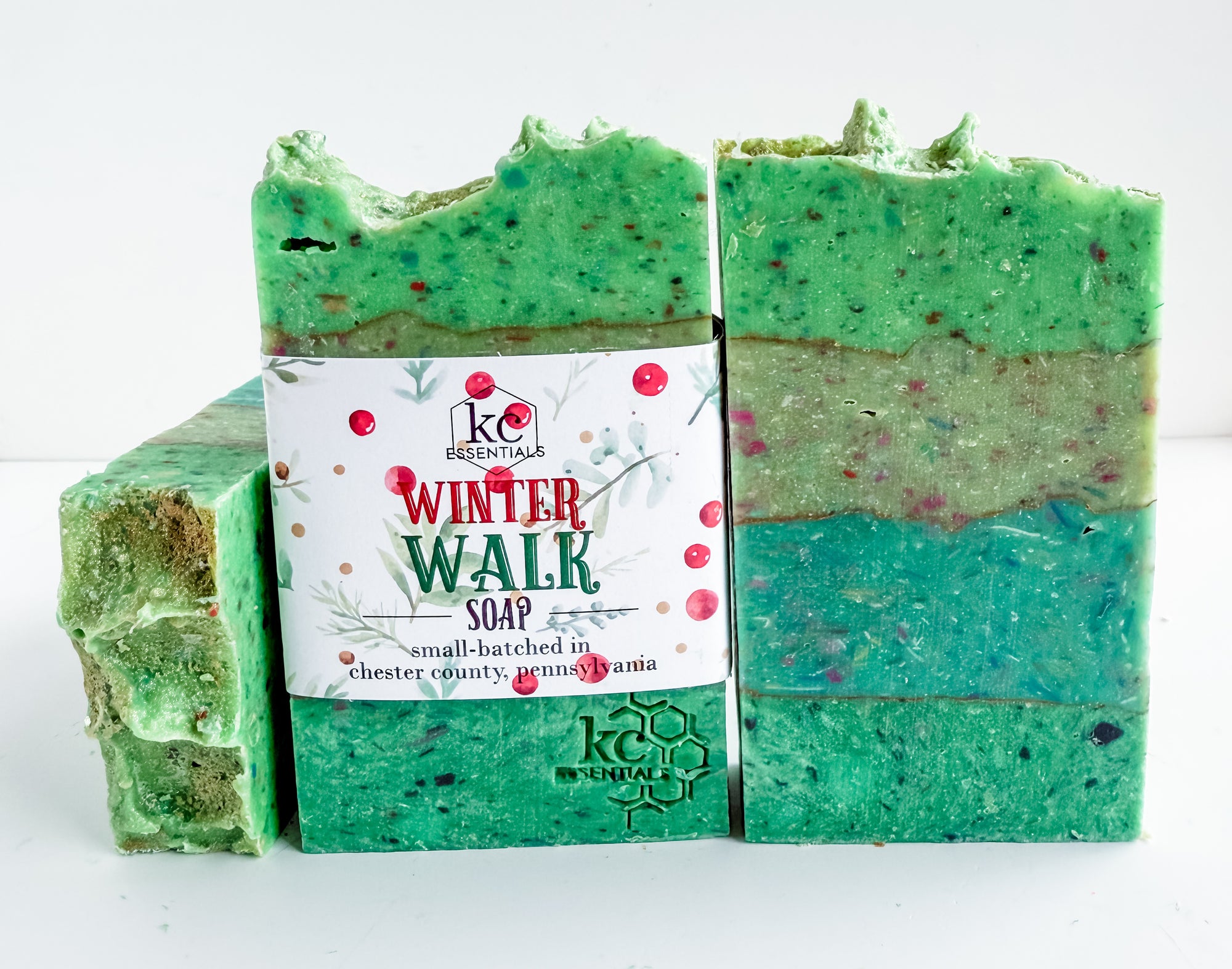 Green layered soap with a 'Winter Walk' label on a white background, all natural homemade soap, all natural ingredients, vegan, winter, christmas scented, holiday