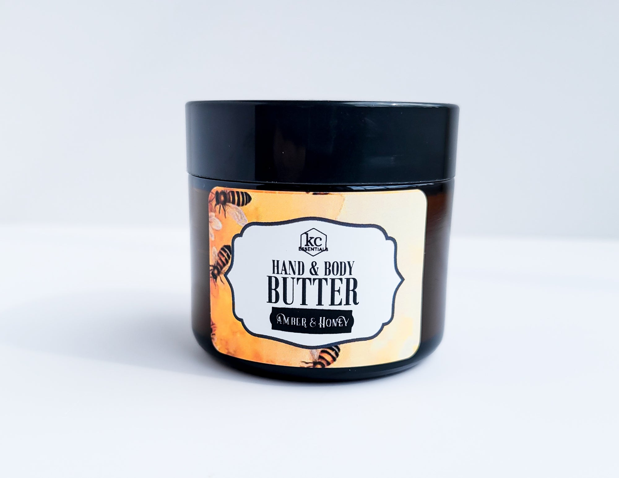 hand and body butter, made with jojoba oil, beeswax, mango butter, and coconut butter, 2 ounces, amber and honey scented.